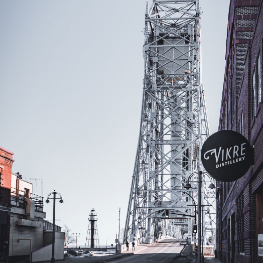 A street view from Vikre Distillery of the the Aerial Lift Bridge in Canal Park in Duluth, MN