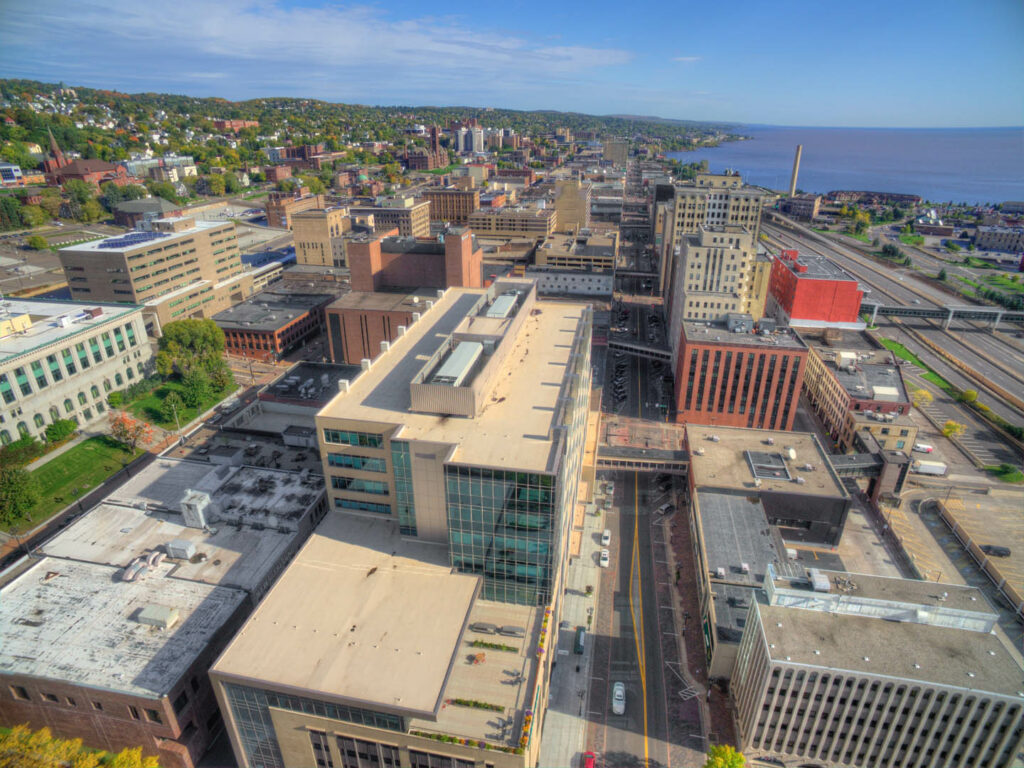 An aerial view of downtown duluth buildings and rooftops.