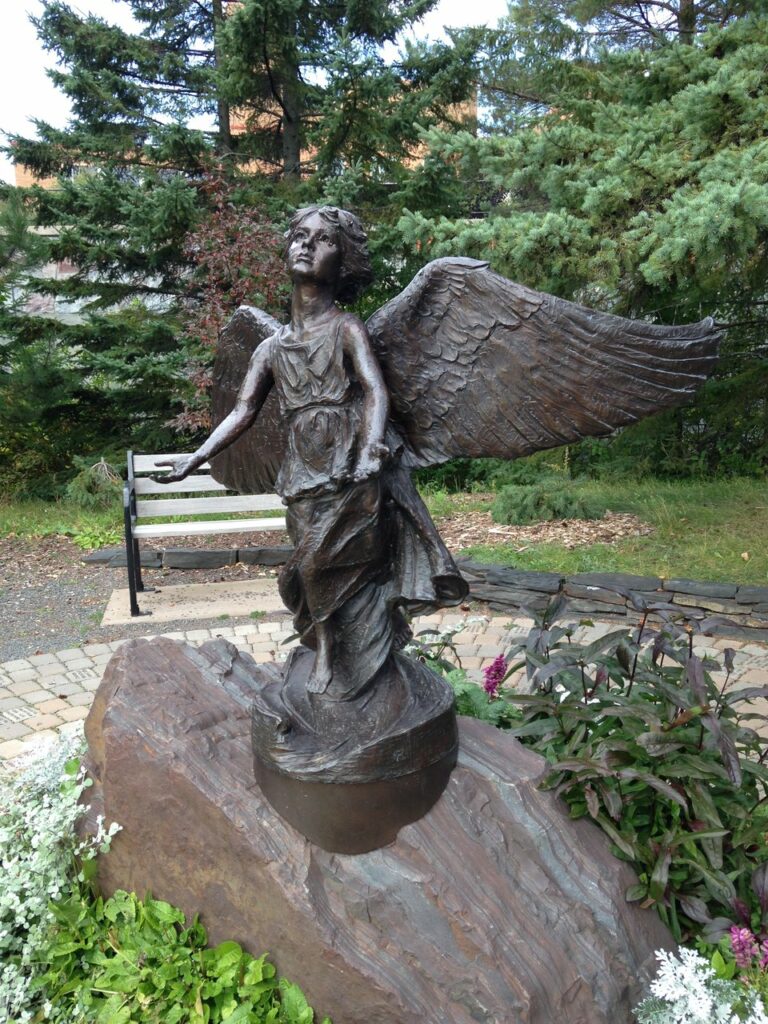 A bronze sculpture of an angel.