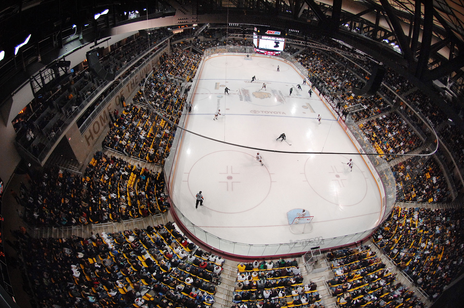 Looking down on the hockey ice from the ceiling of the Amsoil Arena. Hockey game below.