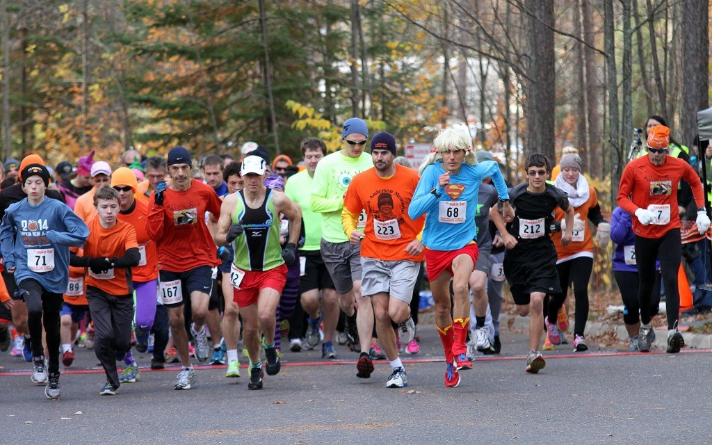 People wearing lots of orange running the Pumpkin Run.