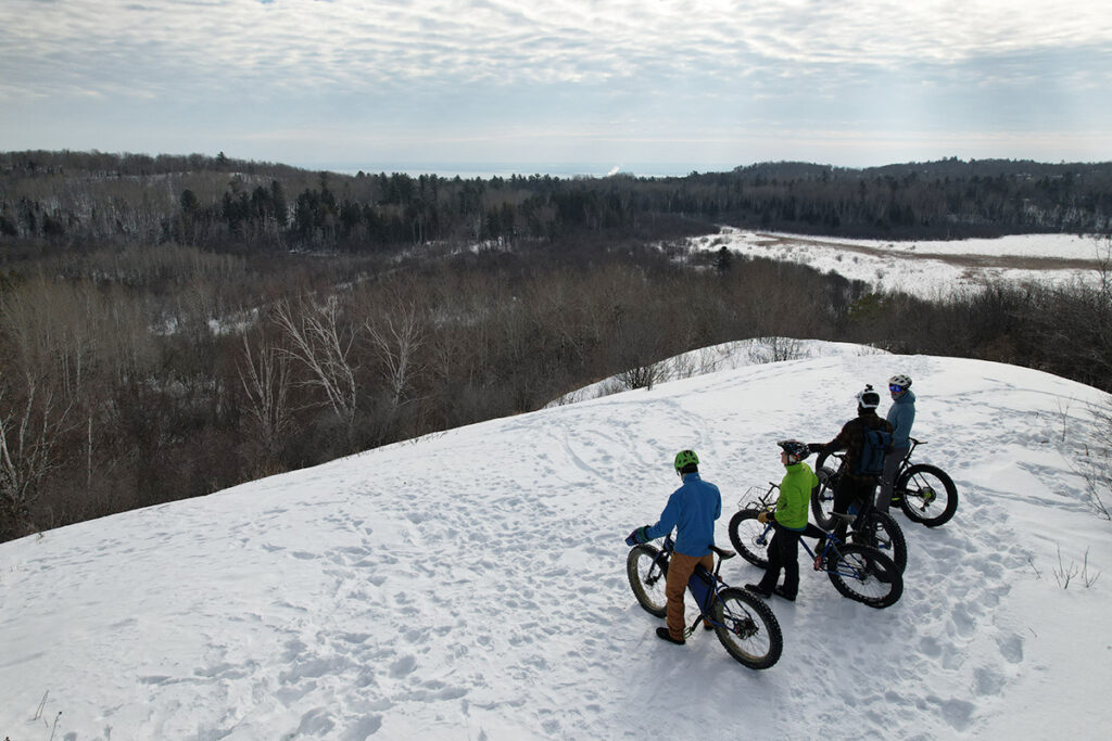 Bikers on a snow hill