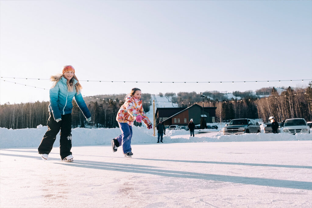 Two children ice skating