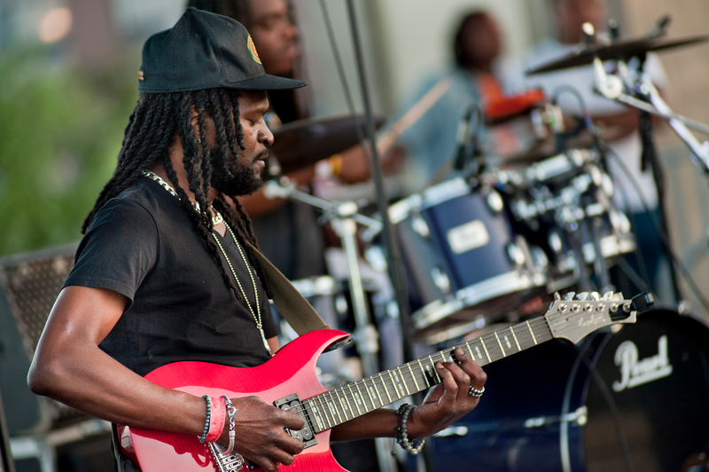 A guitar player performs at Reggaefest