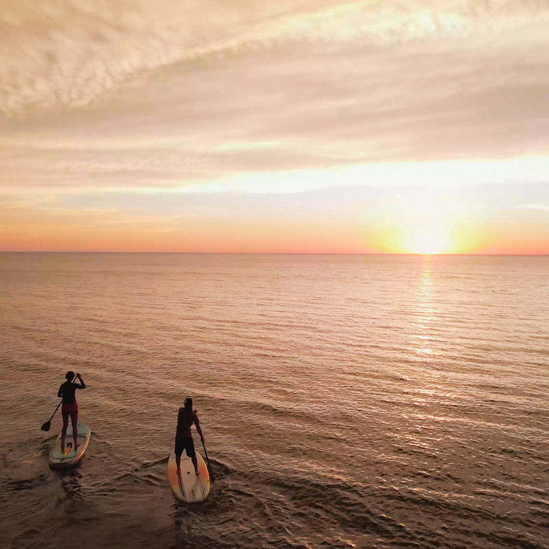 Paddle boarding at sunset in Duluth