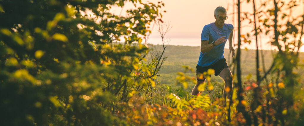 A man trail running on local trails in duluth, mn