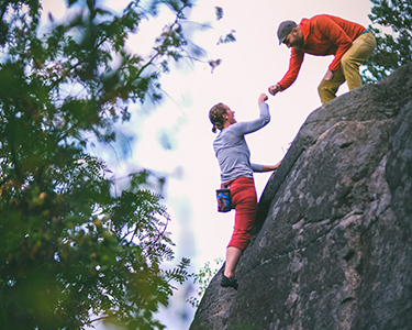 two people rock climbing