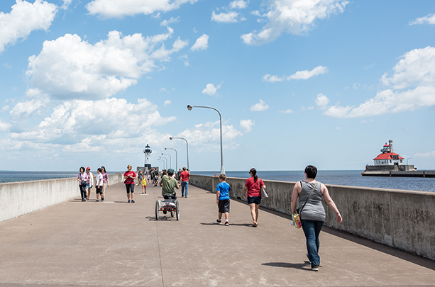 people walking on the pier