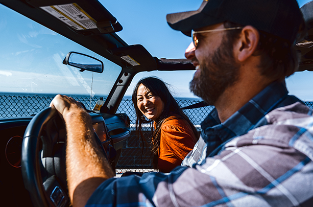 Couple riding in Jeep