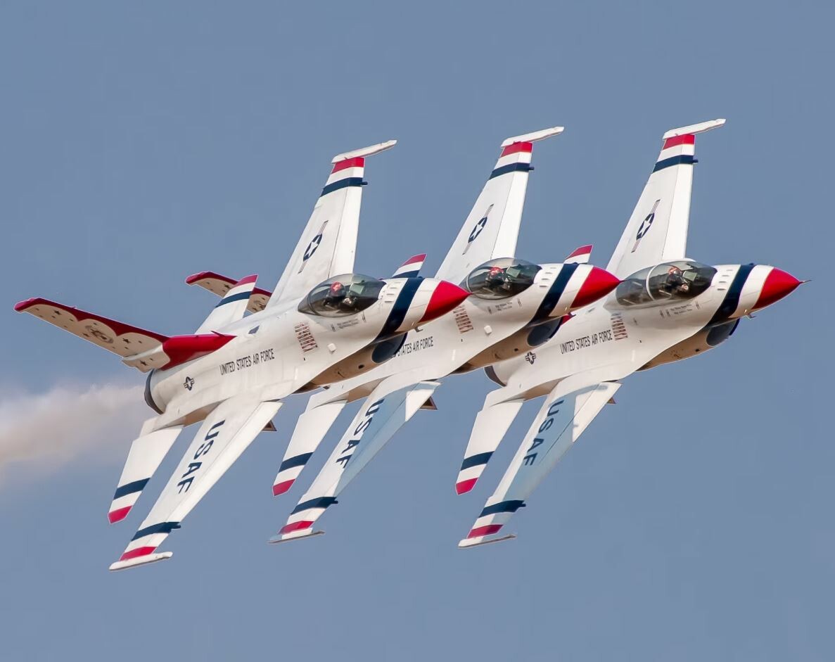 Three Air Force Thunderbirds flying