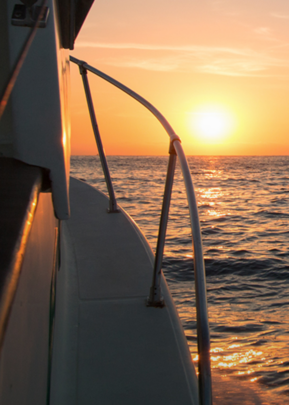 Charter fishing boat at sunset