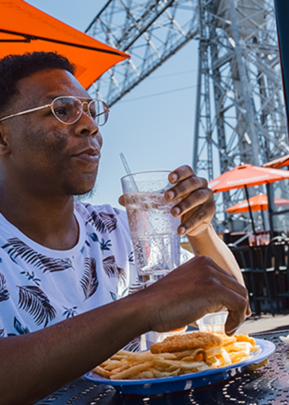 guy sitting outside eating