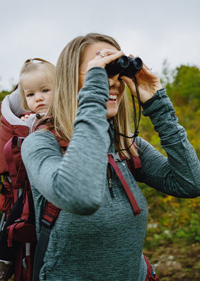 Woman looking through binoculars