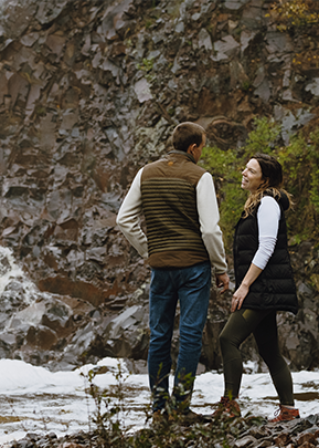 Couple standing on fall trail