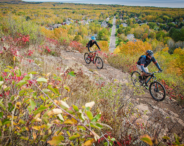 Two bikers enjoying the trail