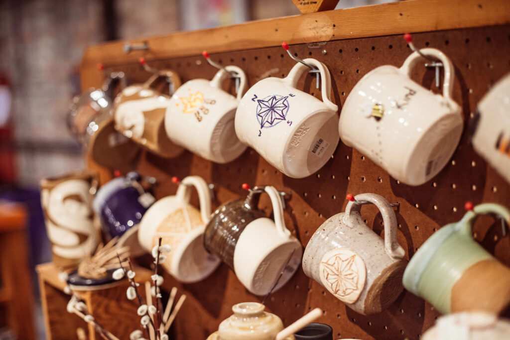 assorted coffee mugs on display for purchase