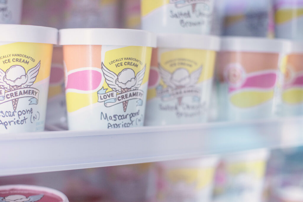 close up of ice cream pint display case