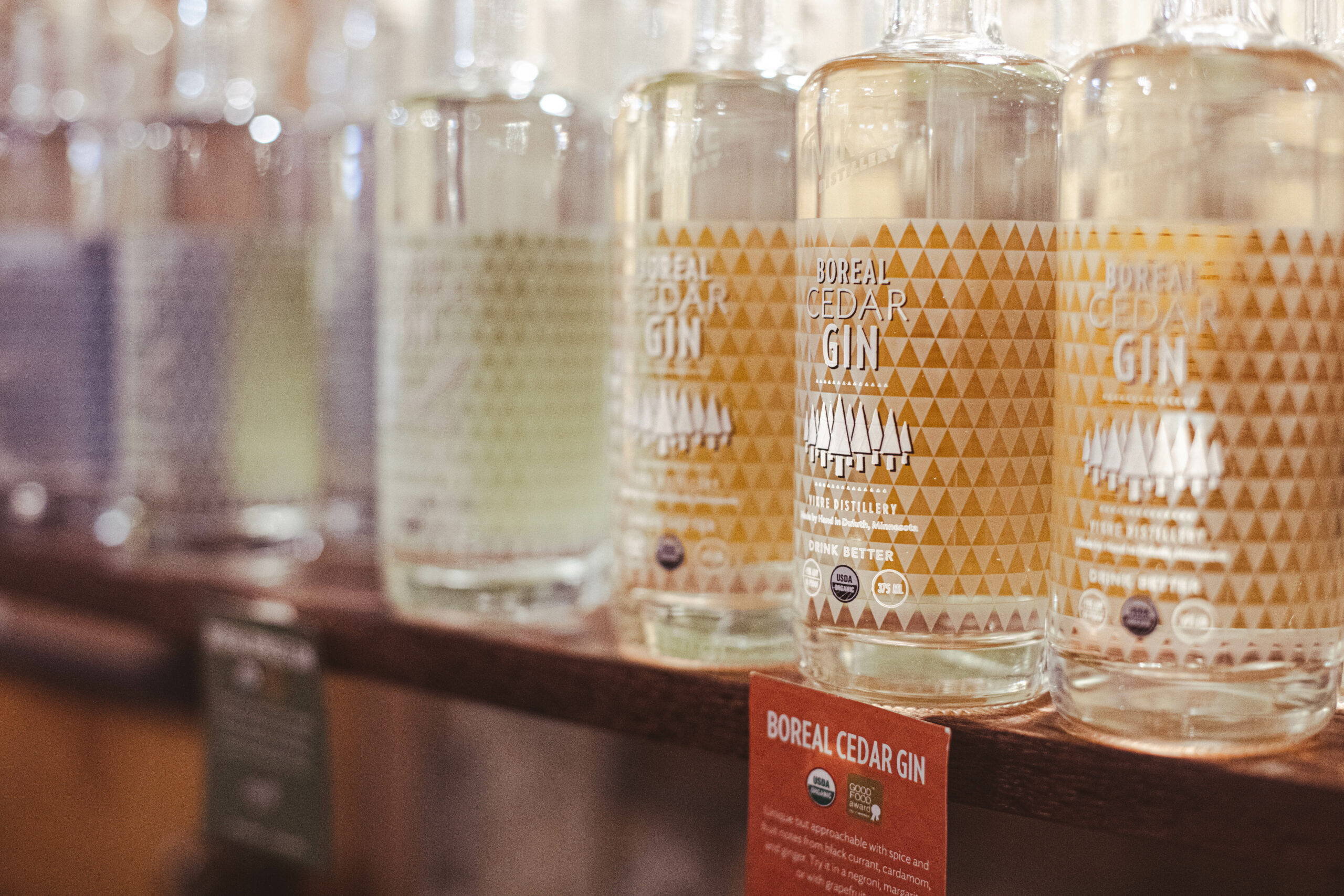 close up image of bottles of gin on a store shelf