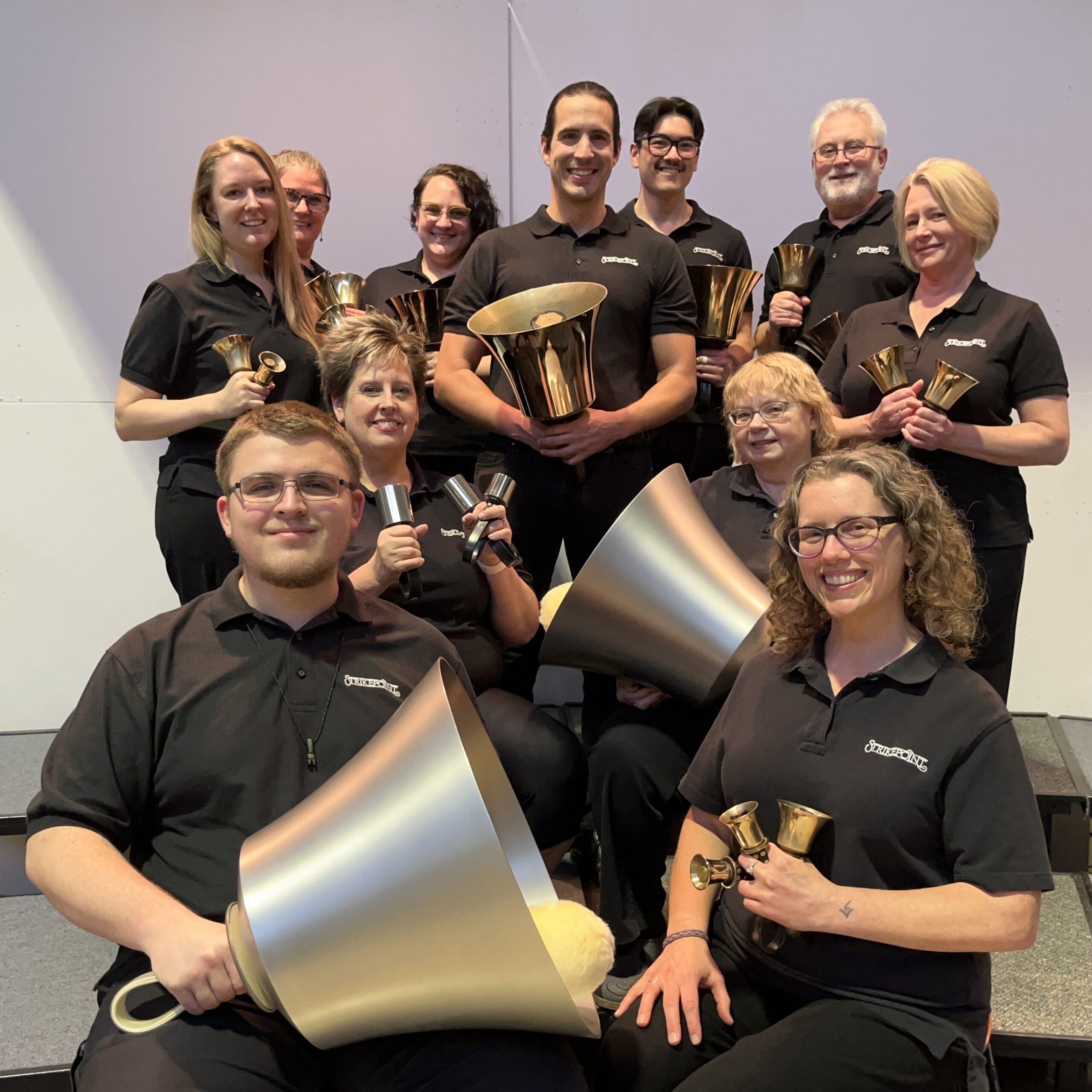 group image of handbell choir holding bells