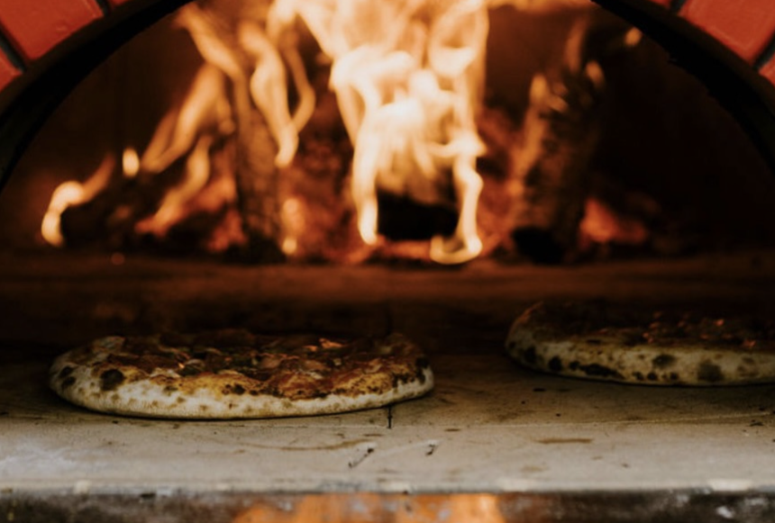 Listings 8 Two wood fire pizzas baking