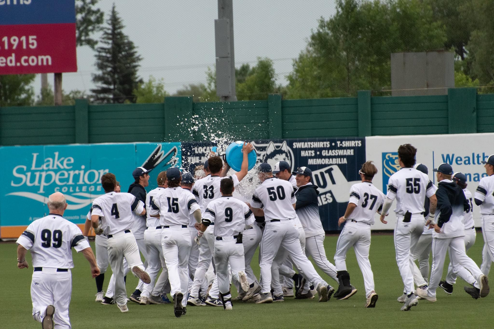 Duluth huskies baseball team celebrating victory with water in duluth, mn