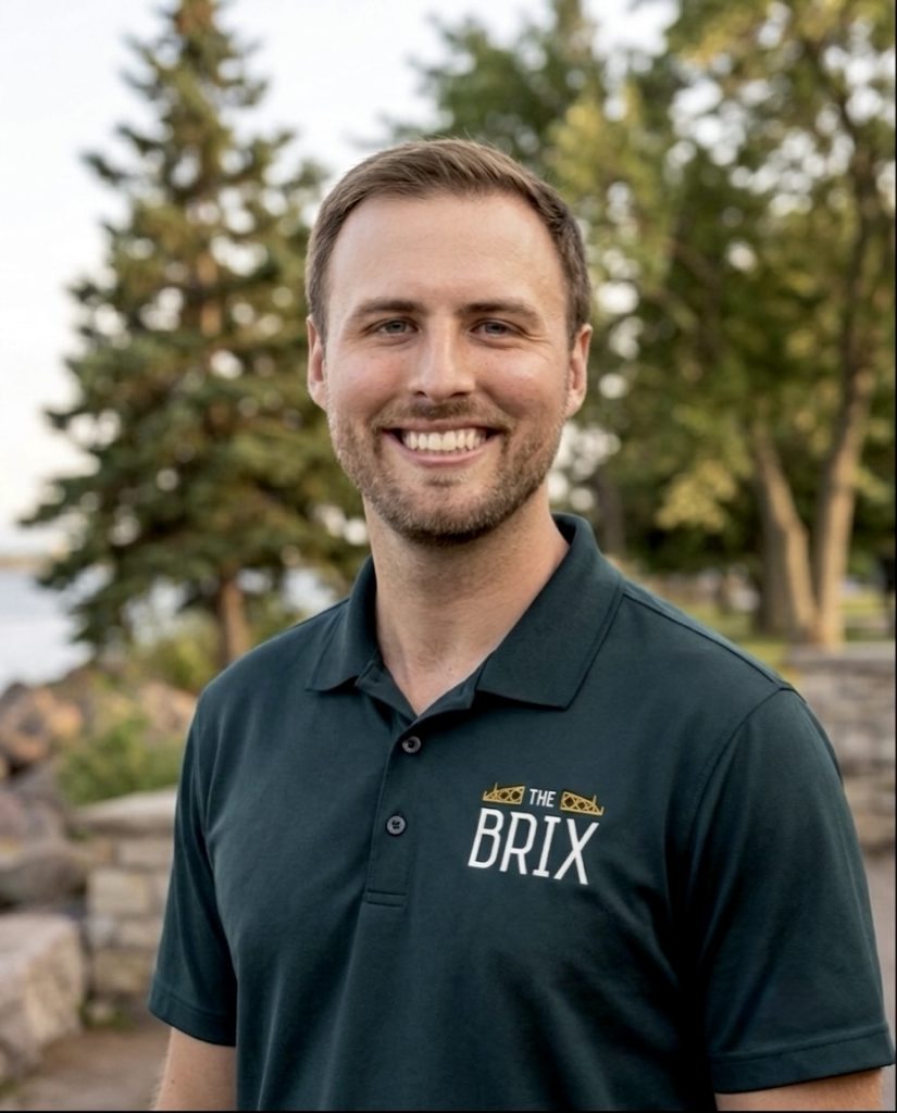 The brix: a different kind of stay in duluth 11 Smiling man in polo shirt with a label that says, the brix