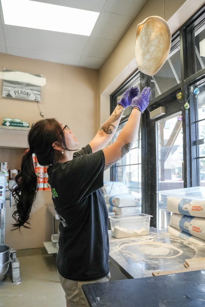 How vitta pizza became a duluth favorite 4 A staff member tossing fresh pizza dough in the air at vitta pizza in duluth, mn.