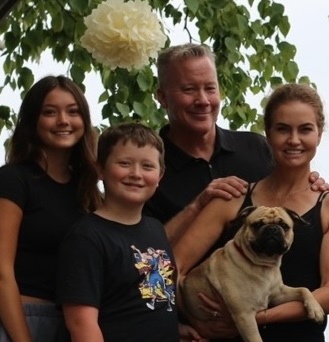 How vitta pizza became a duluth favorite 14 Christie and brad erickson, owners of vitta pizza, with their family and their pug, posing together outside under trees.